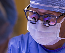 doctor in mask and glasses for robotic surgery